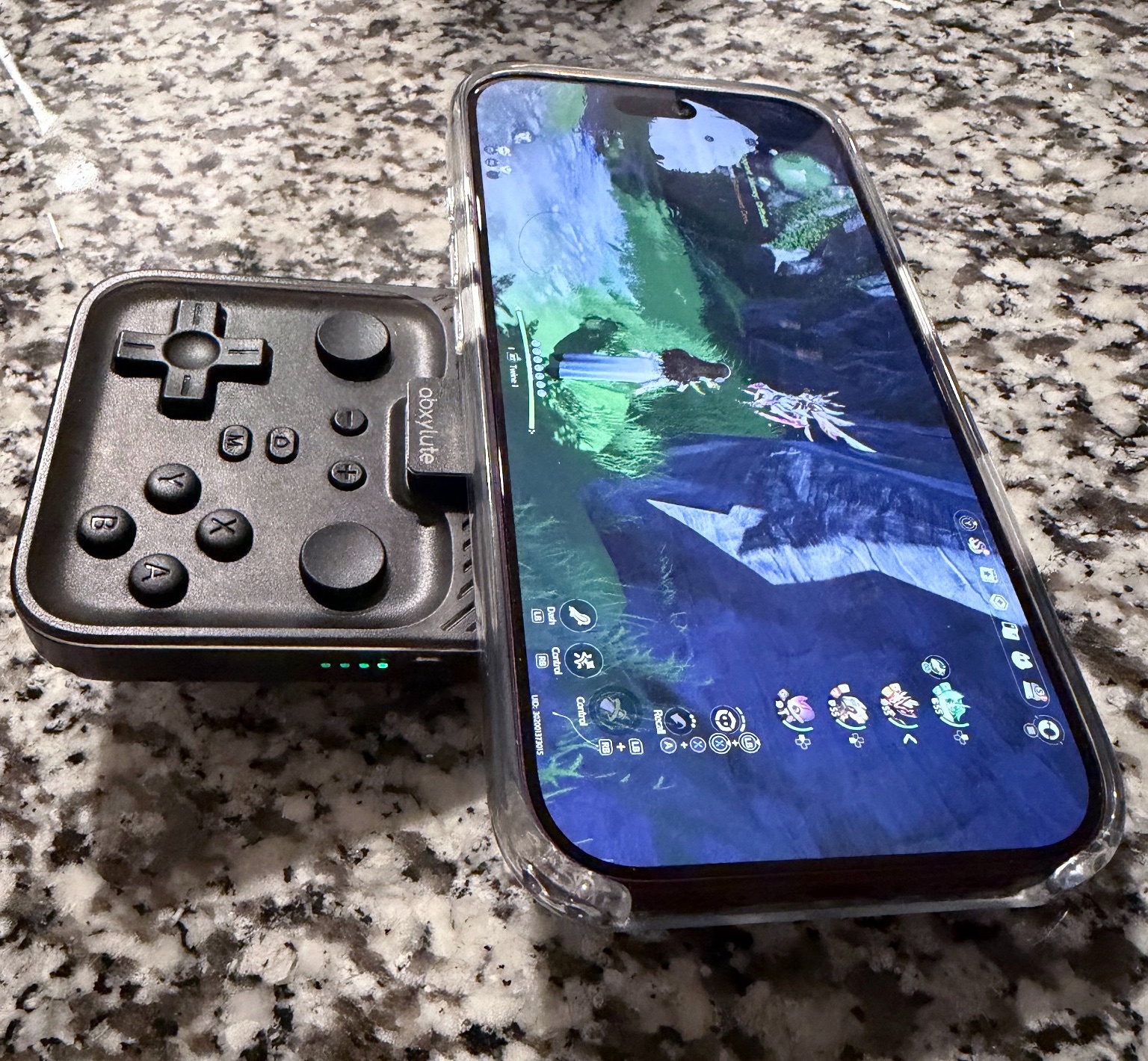 Angled view of the abxylute M4 attached to a phone